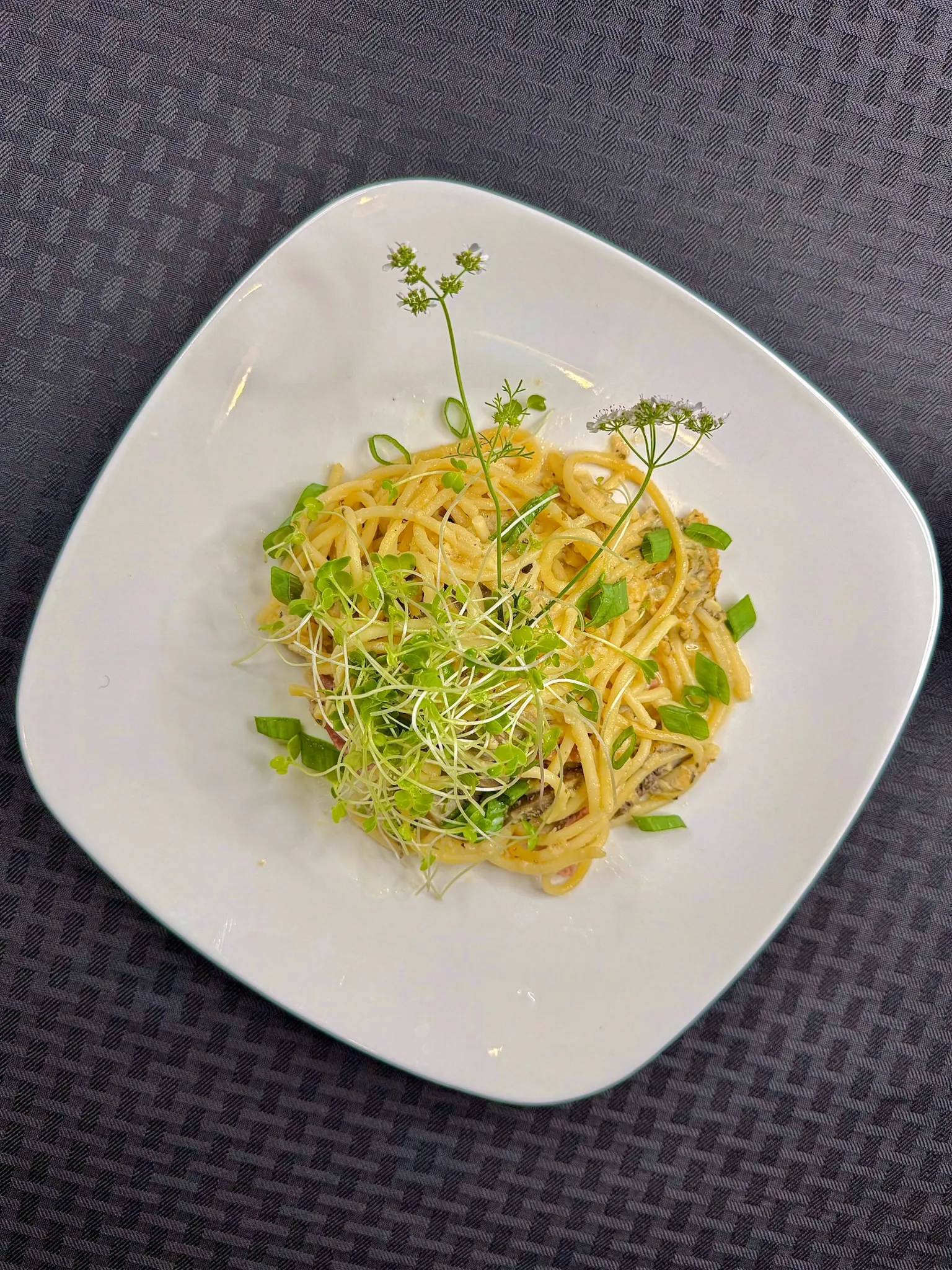 Garden herb pasta with edible flowers